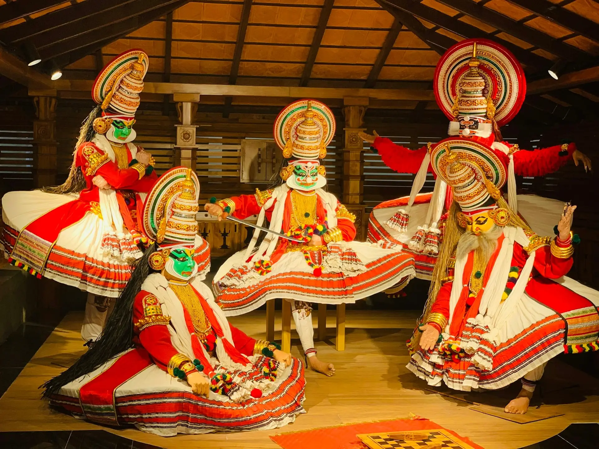 Kathakali dancers in full costume and painted faces performing in Kochi