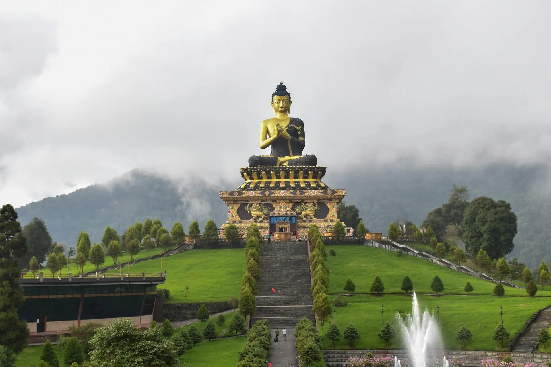 The great Buddha statue at Tathagata Tsal, Ravangla, above green hills